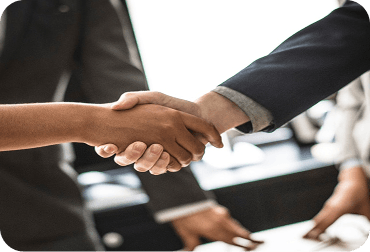 Business professionals shaking hands symbolizing partnership